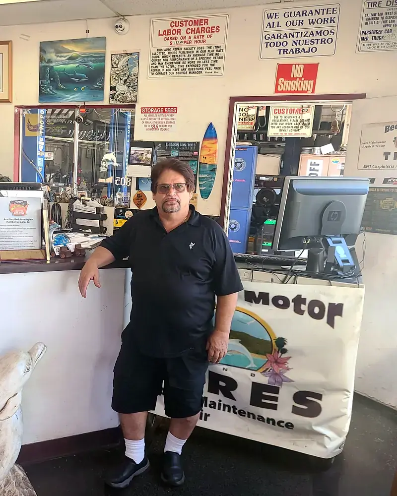 Abel Zuniga, owner of Beach Motor & Tires, at the front counter