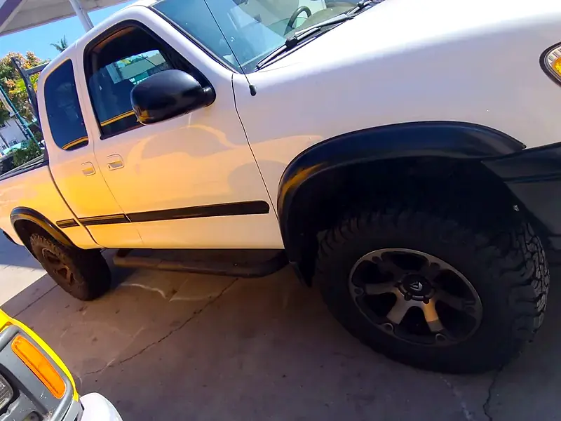 A customer’s Toyota Tundra under the canopy on a new set of all-terrain tires