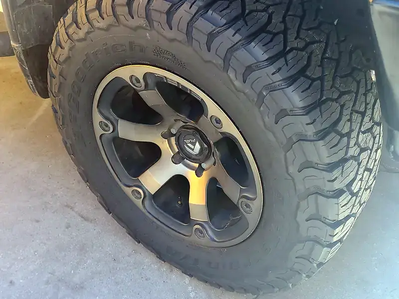 New all-terrain tire and wheel on a Toyota Tundra at Beach Motor & Tires